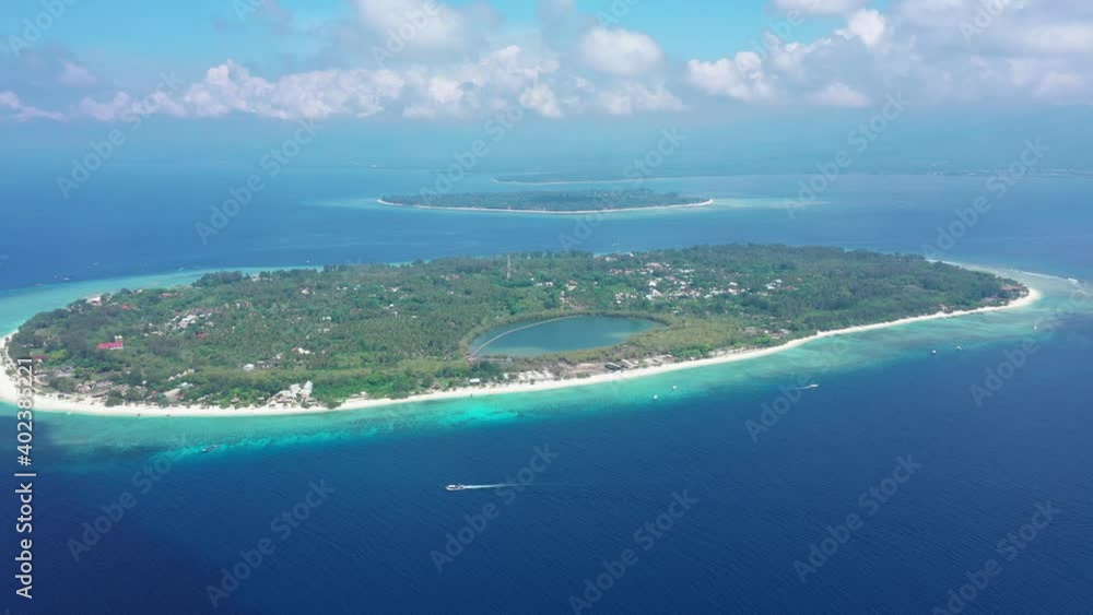 Aerial view scenic Gili Meno Trawangan island lapped by the Indian ocean from a sunny warm day. Concept of a little Paradise Island Aerial view scenic Gili Meno Trawangan island lapped by the Indian ocean from a sunny warm day. Concept of a little Paradise Island