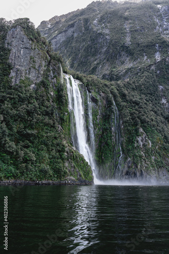 Stunning waterfall in Milford Sound. Fiordland National Park  New Zealand