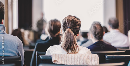 Speaker Giving a Talk at Business Meeting. Audience in the conference hall. Business and Entrepreneurship. Panoramic composition suitable for banners. photo