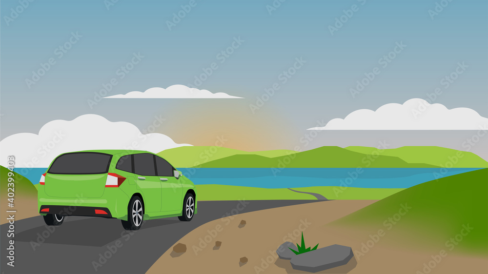Green cars drive on the asphalt road towards the sights of the sea. With the open landscape of meadow and the evening sun. Green cars drive on the asphalt road towards the sights of the sea. With the open landscape of meadow and the evening sun.