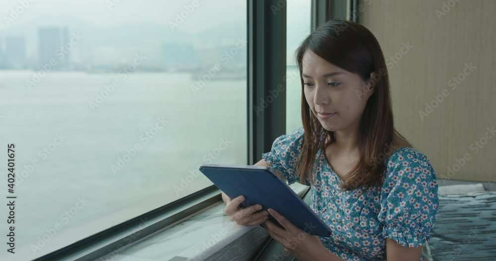 Woman use of tablet computer at home Woman use of tablet computer at home