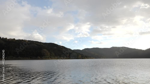 A view of Lake Yogo taken in autumn under a light rain. photo