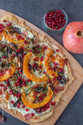 tarte flambe wirh pumpkin and pomegranate photo