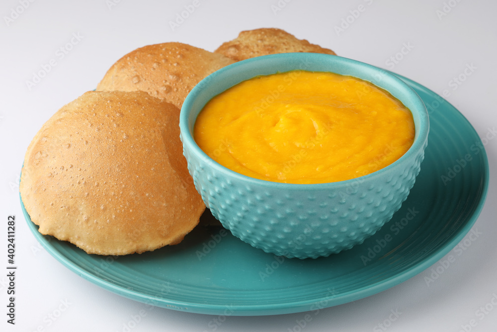 Indian Food - Aamras is a sweet dish made from the pulp of the Alphonso mango fruit. Served with hot puri/poori. Sweet Mango puree garnished with Kashmiri Saffron. Aam Ras Puri OR Alphonso Mango pulp Indian Food - Aamras is a sweet dish made from the pulp of the Alphonso mango fruit. Served with hot puri/poori. Sweet Mango puree garnished with Kashmiri Saffron. Aam Ras Puri OR Alphonso Mango pulp