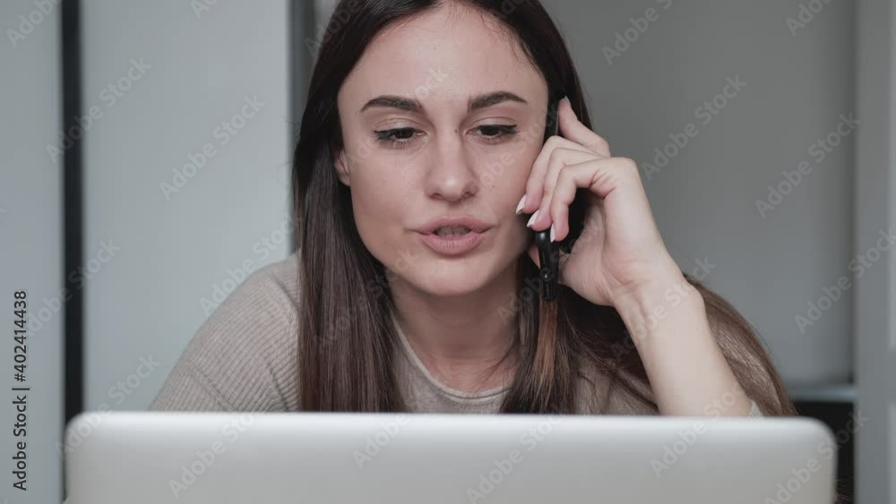 Business woman talking mobile phone at home workplace. Close up of businessman call phone. Portrait of female professional working at home office. Casual worker call smartphone Business woman talking mobile phone at home workplace. Close up of businessman call phone. Portrait of female professional working at home office. Casual worker call smartphone