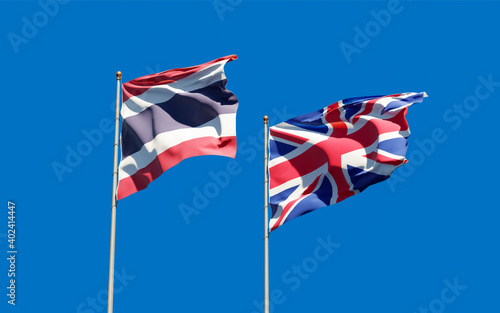 Flags of UK and Thailand.