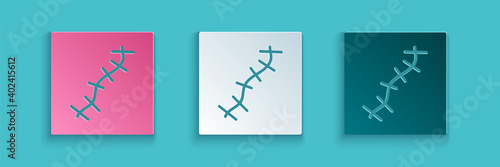 Paper cut Scar with suture icon isolated on blue background. Paper art style. Vector.