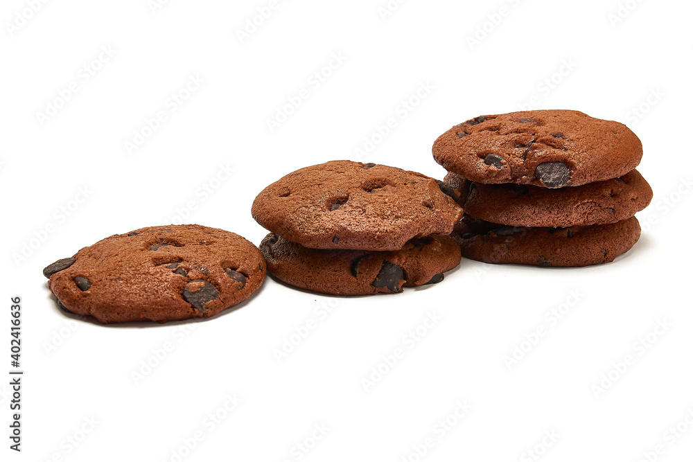 Delicious cookies with cocoa powder and droplets of chocolate icing on white background. Delicious cookies with cocoa powder and droplets of chocolate icing on white background.
