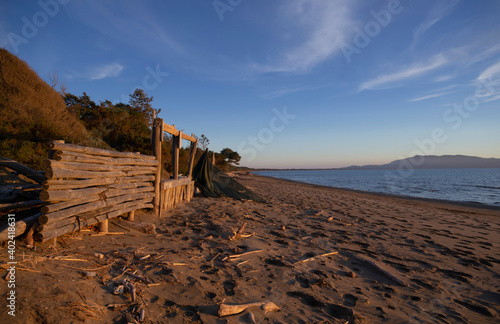 scenic view of the sand dune of the Thyrrenian sea in Tuscany region at dusk photo