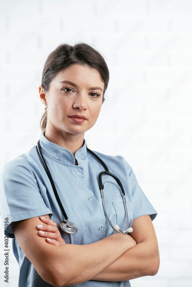Beautiful female doctor working in the clinic. Beautiful nurse with stethoscope Beautiful female doctor working in the clinic. Beautiful nurse with stethoscope