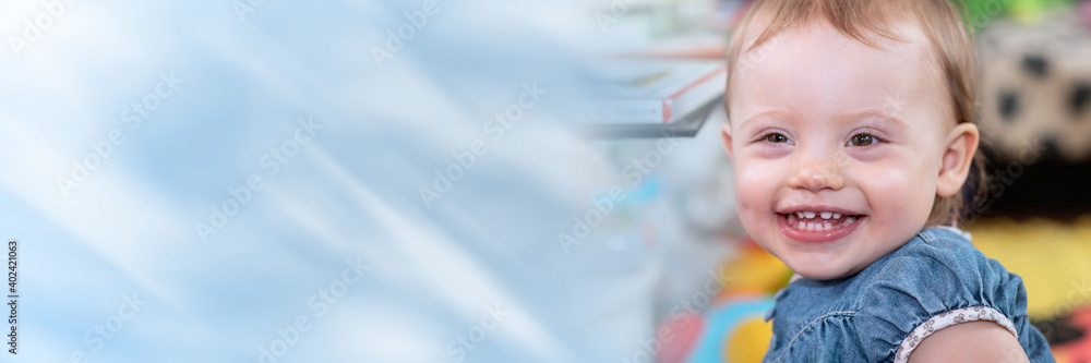 Portrait of happy baby girl; panoramic banner Portrait of happy baby girl; panoramic banner