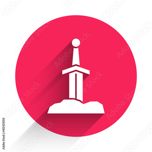 White Sword in the stone icon isolated with long shadow. Excalibur the sword in the stone from the Arthurian legends. Red circle button. Vector.