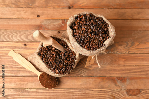 Composition with coffee bags on wooden background