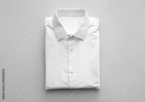 Folded male shirt on light background Fototapet