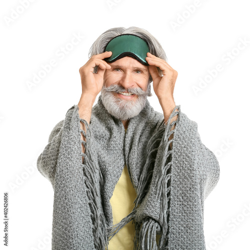 Mature man in sleep mask on...