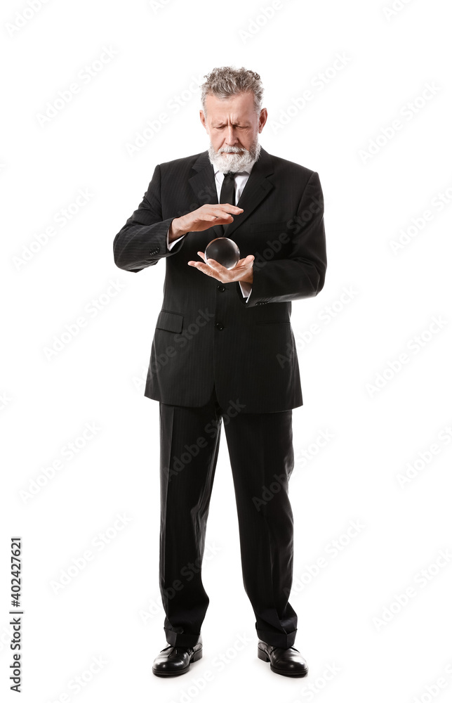 Male fortune teller with crystal ball on white background