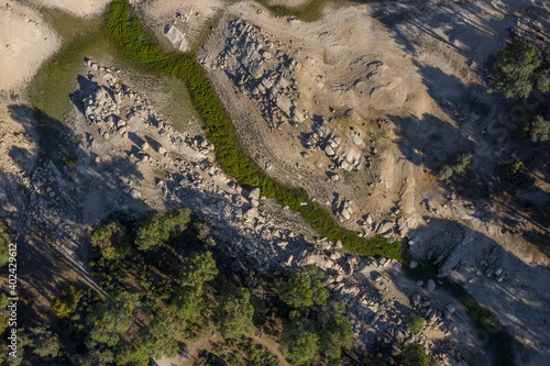 Aerial Zenith views of forest, fields and old wooden bridge