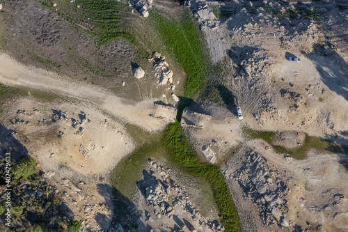 Aerial Zenith views of forest, fields and old wooden bridge