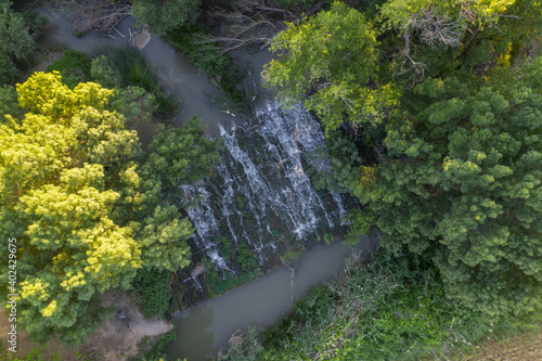 Aerial Zenith views of forest, fields and old wooden bridge