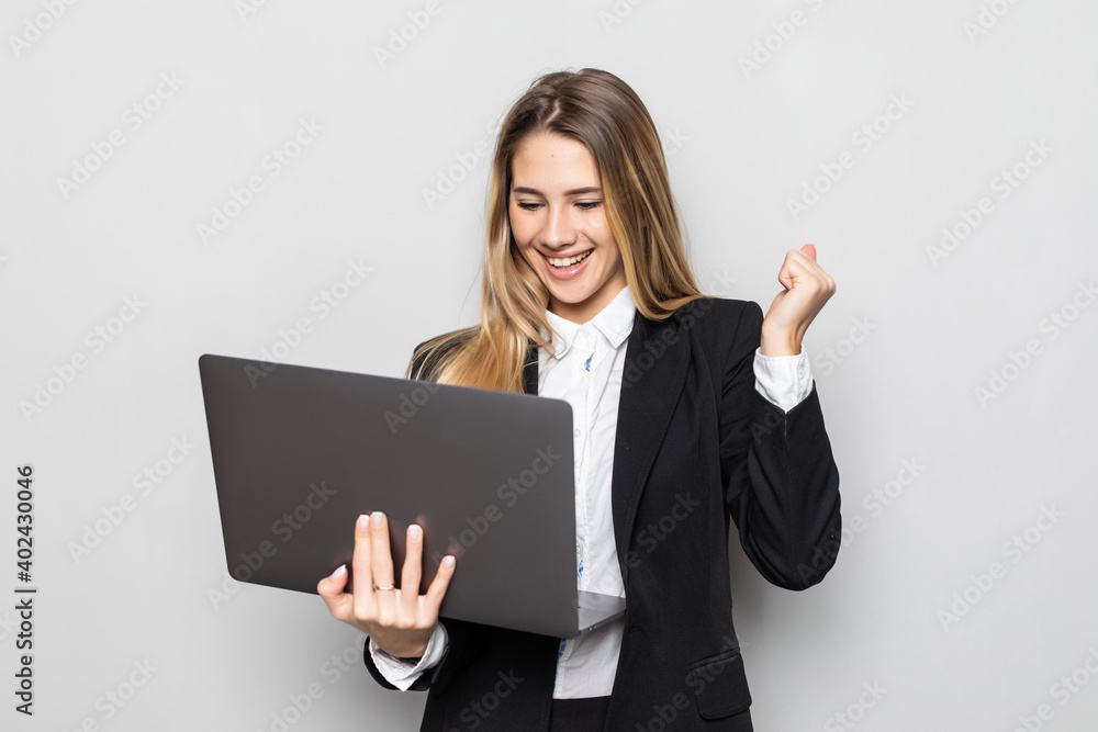 Attractive beautiful businesswoman get successful of business. Charming beautiful woman hold laptop and looking some information of business. Attractive beautiful businesswoman get successful of business. Charming beautiful woman hold laptop and looking some information of business.