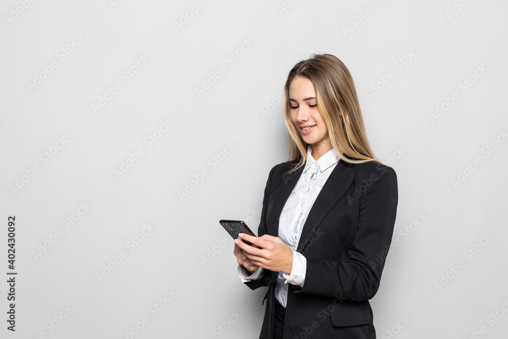 Young businesswoman look at cellphone isolated on white background Young businesswoman look at cellphone isolated on white background