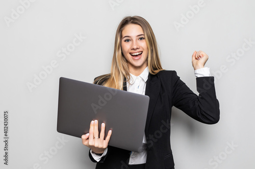 Attractive beautiful businesswoman get successful of business. Charming beautiful woman hold laptop and looking some information of business.