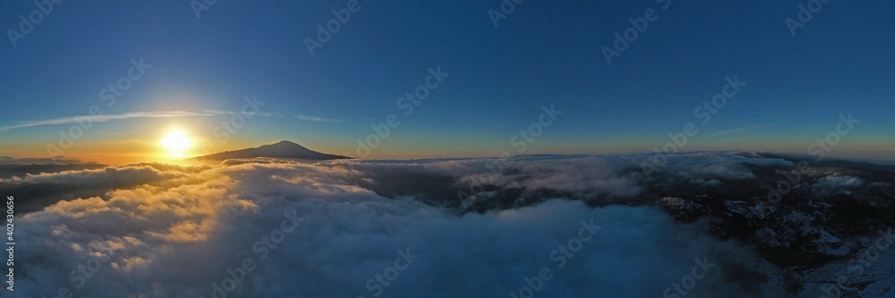 180 degree virtual reality panorama of sunrise above the clouds with view of Etna volcano, Sicily, Italy.