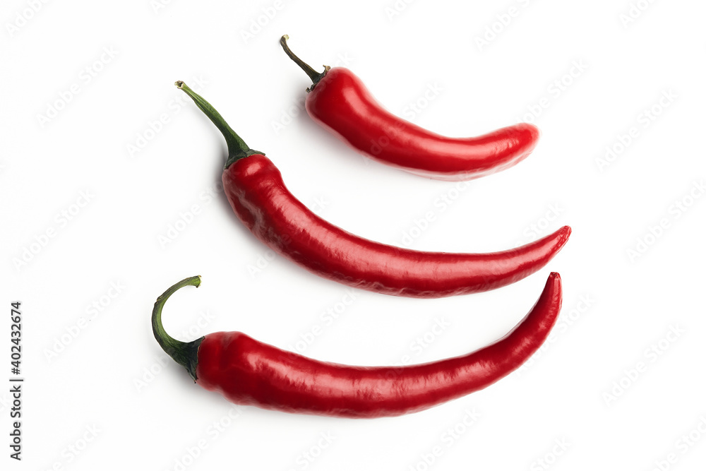 3 red chilli peppers on a white plate, white clean background, chili peppers, bio products