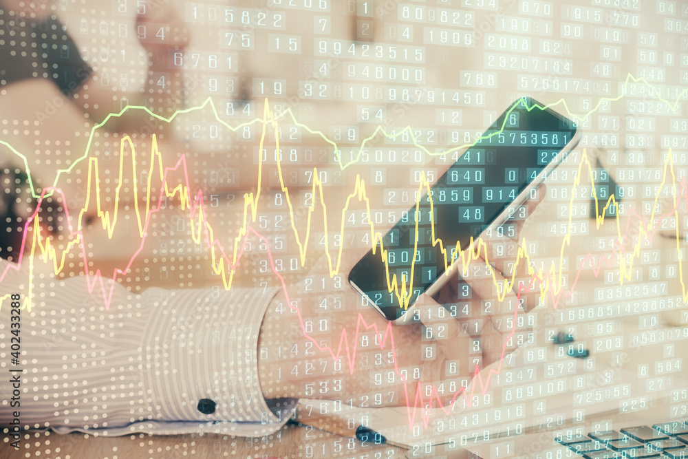 Double exposure of man's hands holding and using a digital device and forex graph drawing. Financial market concept. Double exposure of man's hands holding and using a digital device and forex graph drawing. Financial market concept.