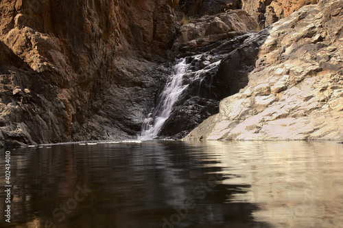 Gran Canaria, landscapes along the hiking route around the ravive Barranco del Toro at the southern part of the 
island, full of caves and grottoes, close to San Agustin resort, water is running in th