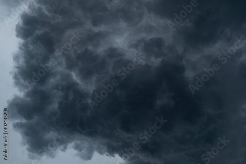 a dramatic background of black clouds that precede the rain