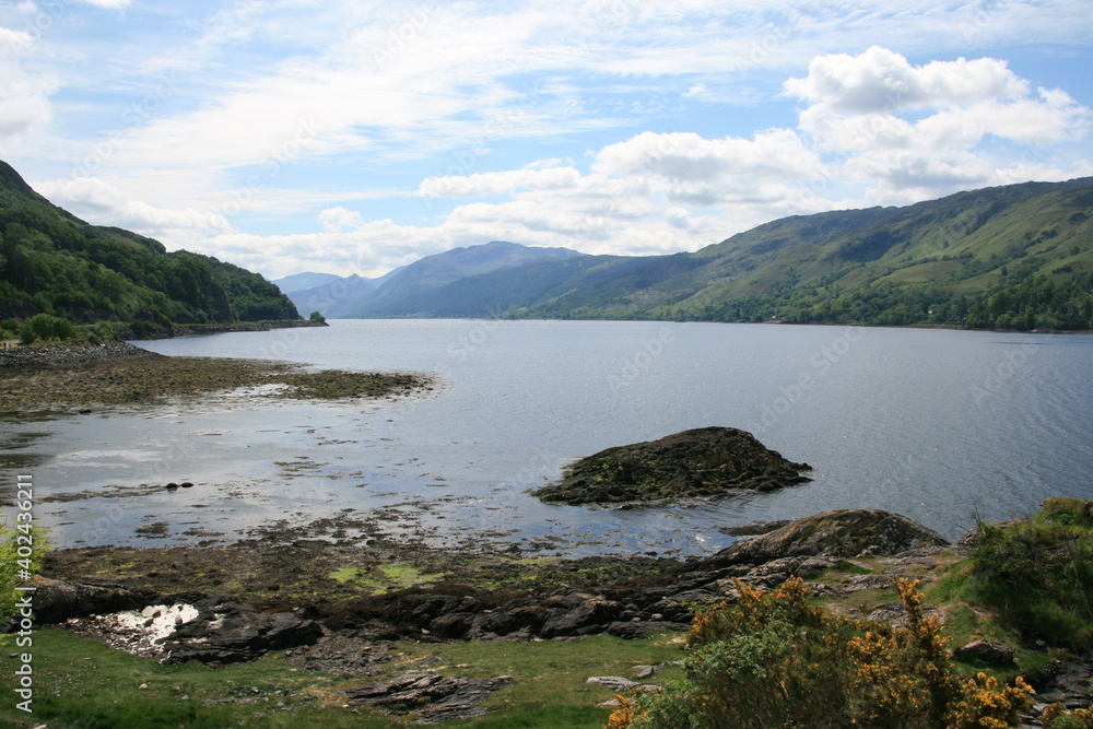 Beautiful scenic view over green hills, rocks and water in Scotland Beautiful scenic view over green hills, rocks and water in Scotland