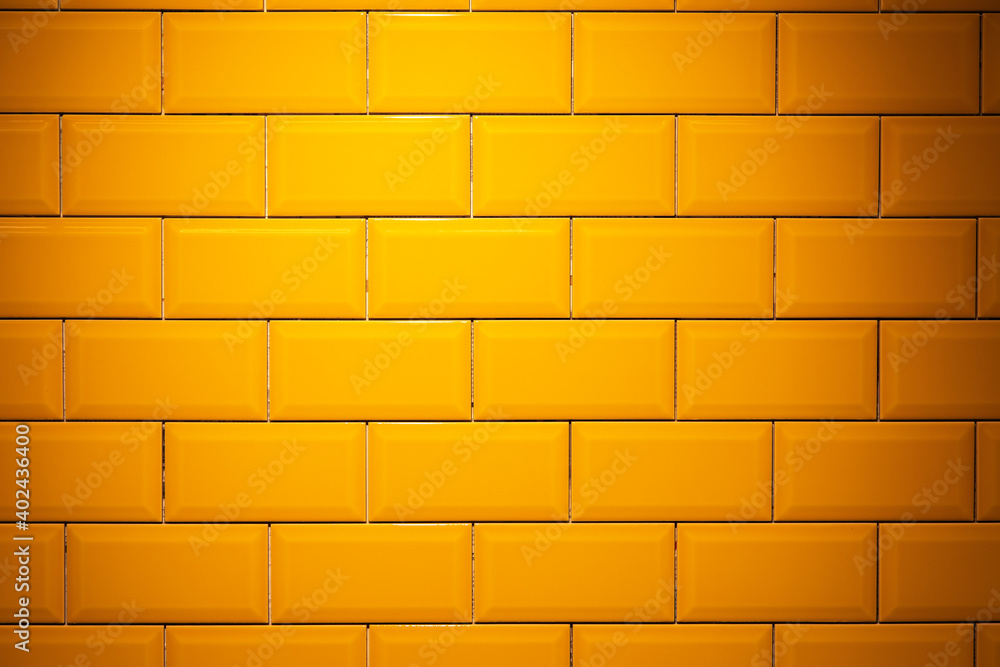 Obraz premium Yellow, glossy ceramic floor tile brick wall texture background.