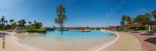 Panoramic view of infinity swimming pool at tropical resort