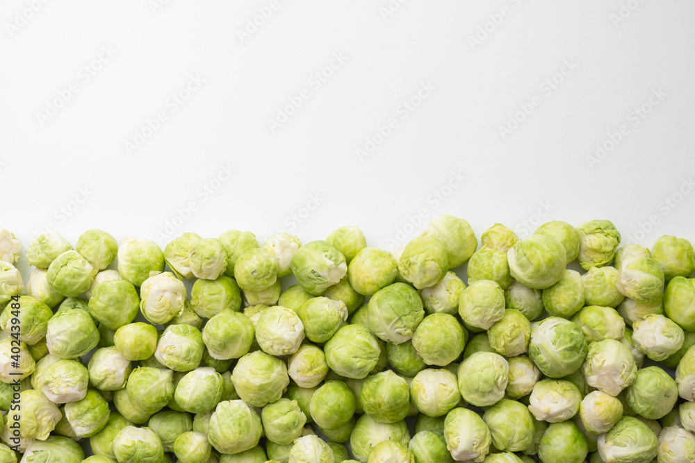 peeled and ripe brussels sprouts spread out on the bottom of the table peeled and ripe brussels sprouts spread out on the bottom of the table