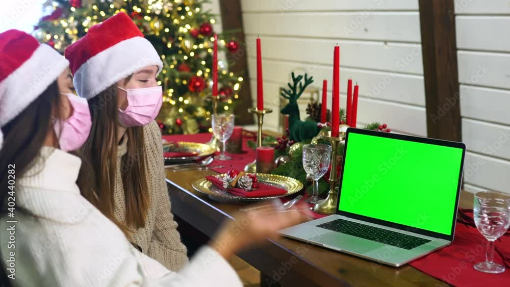 Two girls communicate via the Internet with friends. Two girls communicate via the Internet with friends.