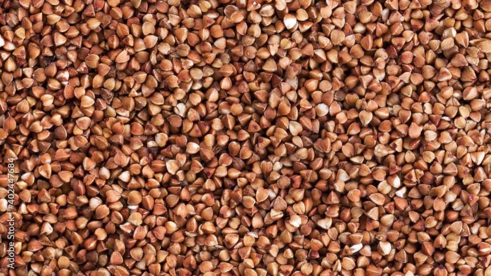 Rotation of a heap of dry brown buckwheat. View from above. Rotation of a heap of dry brown buckwheat. View from above.
