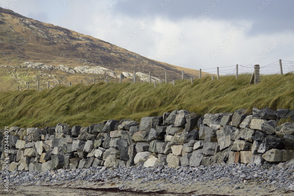 old stone wall on the beach