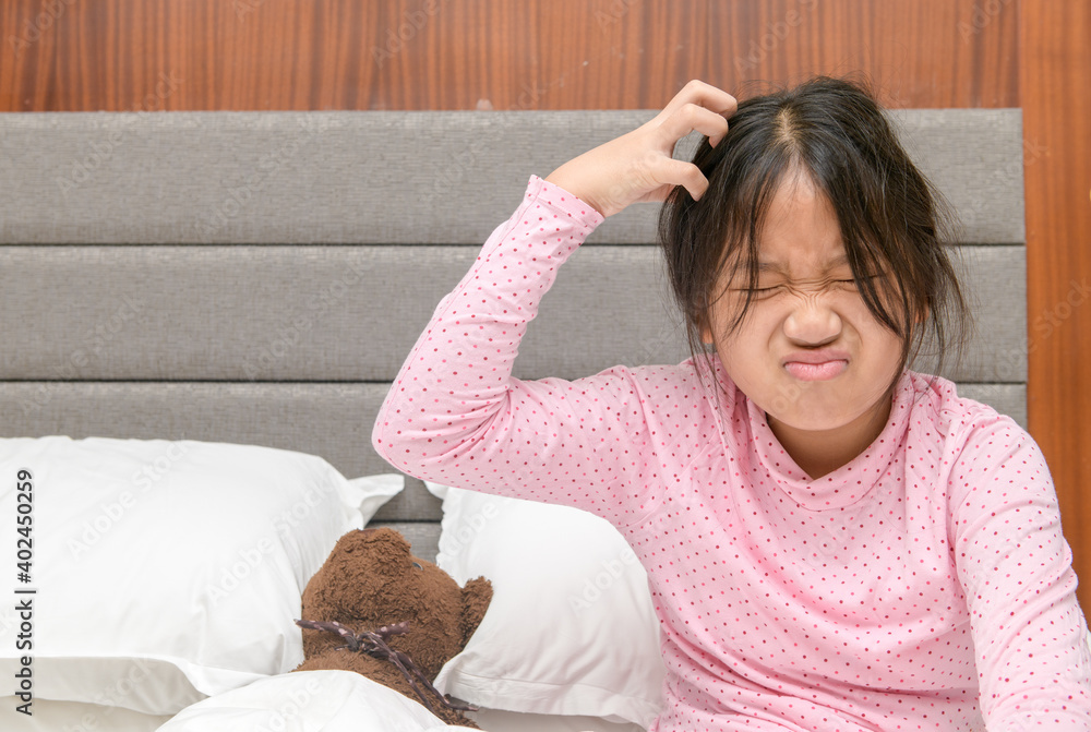 Obraz na plátně Girl itchy her hair or frustrated on bed, problem Health Hair