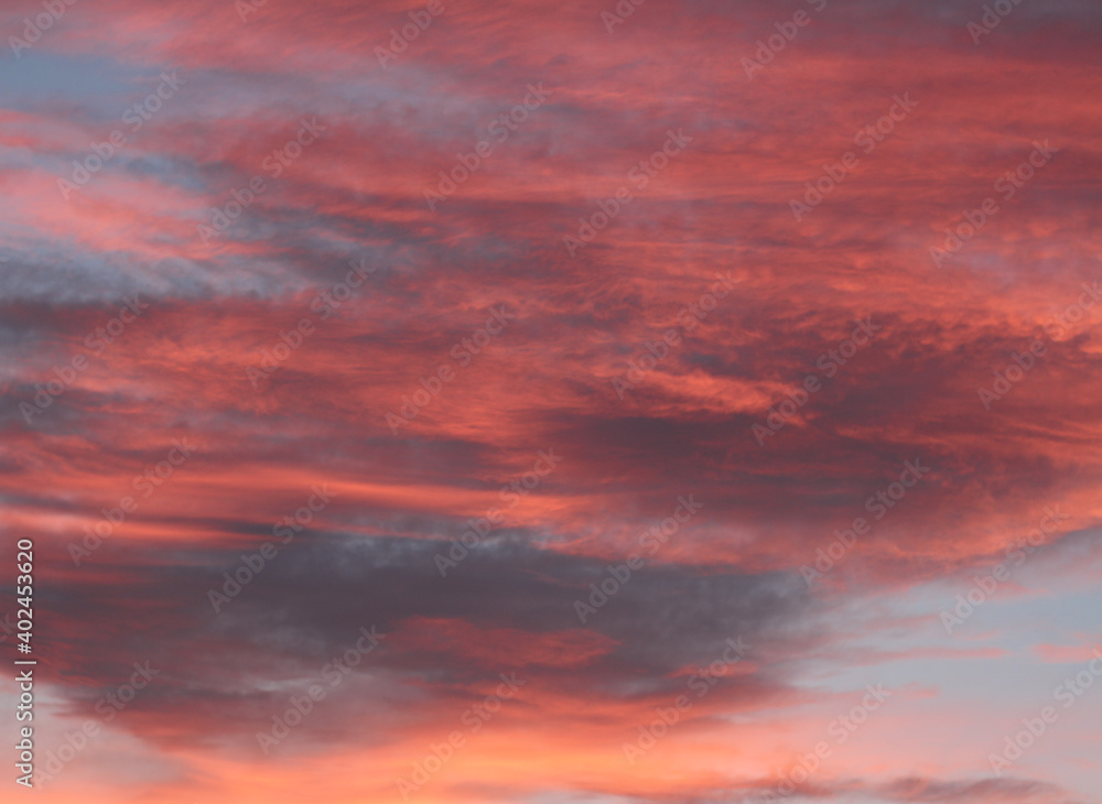 Blue sky, red and black clouds at sunset. Sky, cloud, skyline Blue sky, red and black clouds at sunset. Sky, cloud, skyline