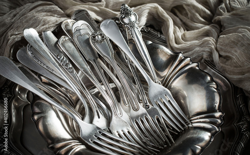 Vintage silverware on old background