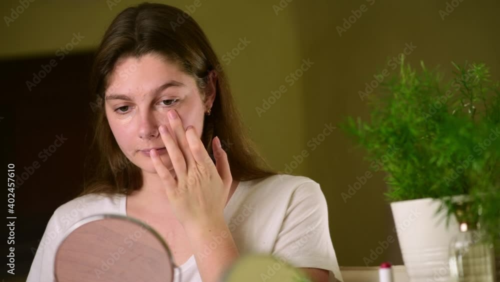 4k Happy attractive young woman blending a concealer, natural no make-up make up, beauty routine, looking in mirror enjoy natural beauty 4k Happy attractive young woman blending a concealer, natural no make-up make up, beauty routine, looking in mirror enjoy natural beauty