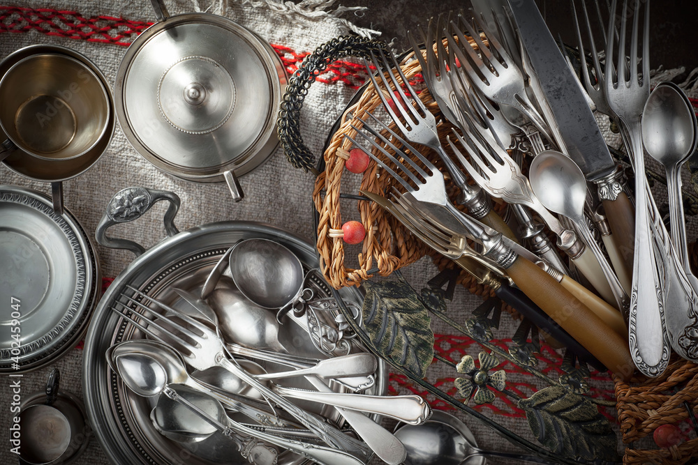 Silver dishes on old background Silver dishes on old background