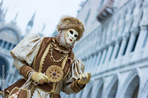 Venice, Italy - February 18, 2020: An unidentified person in a carnival costume in Piazza San Marco attends at the Carnival of Venice.