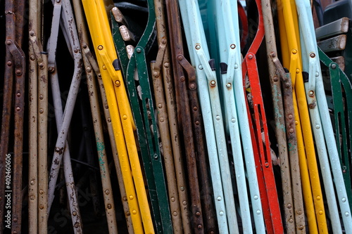 stack of colorful old metal chairs