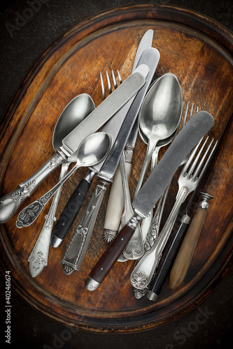 Silver dishes on old background