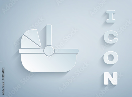 Paper cut Baby stroller icon isolated on grey background. Baby carriage, buggy, pram, stroller, wheel. Paper art style. Vector.