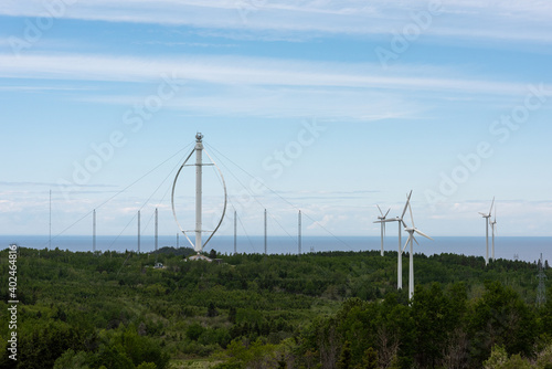 One vertical axis wind turbine in a wind turbines farm photo
