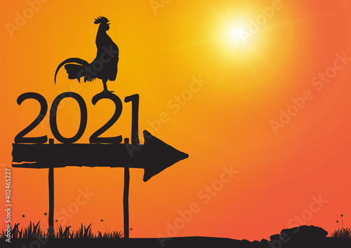 Silhouette of chicken crowing on number 2021 on sunrise background  new year celebration concept vector illustration