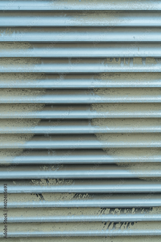 Obraz premium Window shutters painted with paint, urban background, pattern